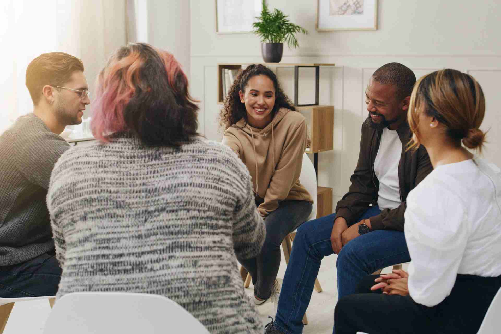 Teenagers participating in an adolescent group therapy session during an intensive outpatient program in New Jersey.