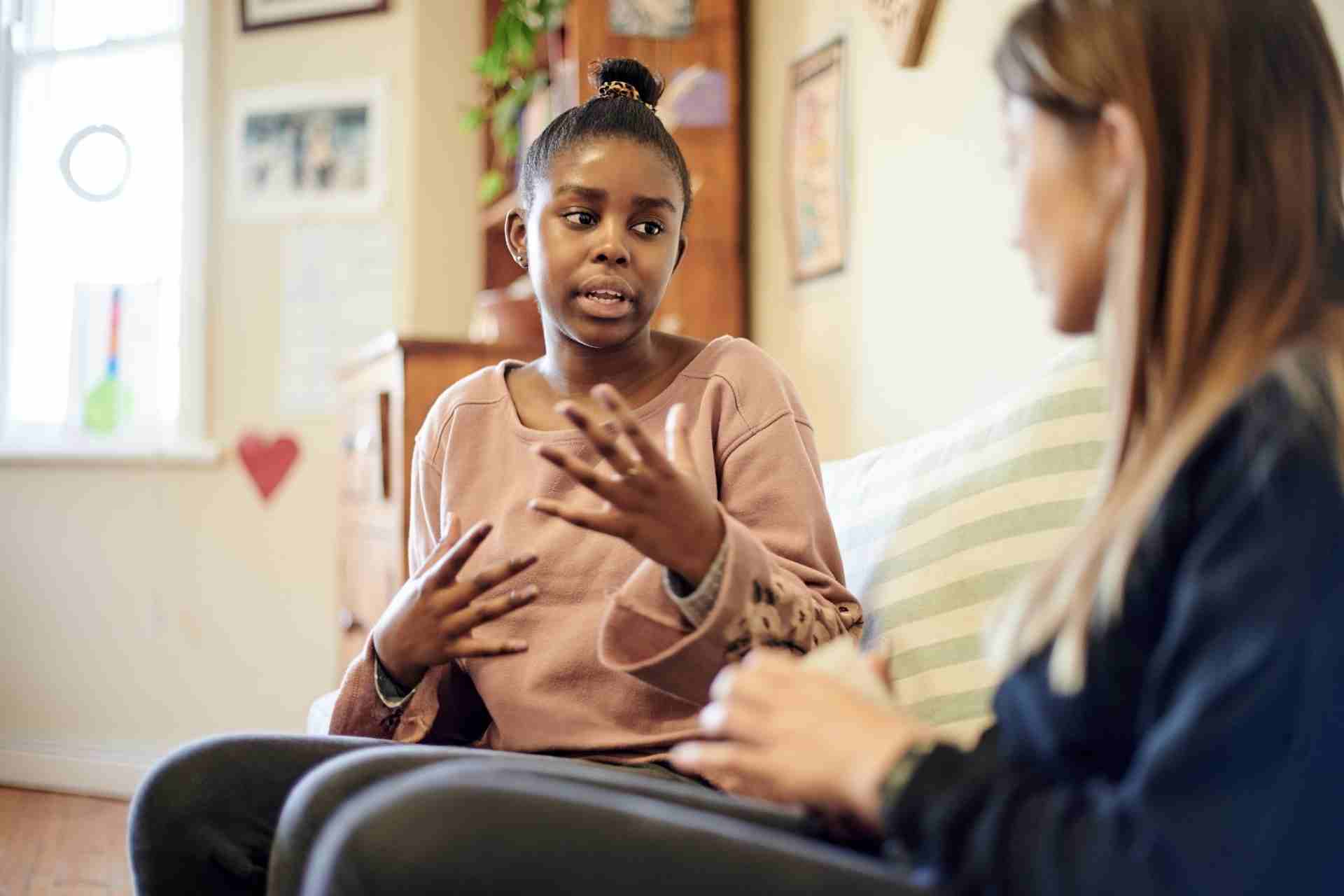 Teen participating in an individual therapy session with a mental health counselor.
