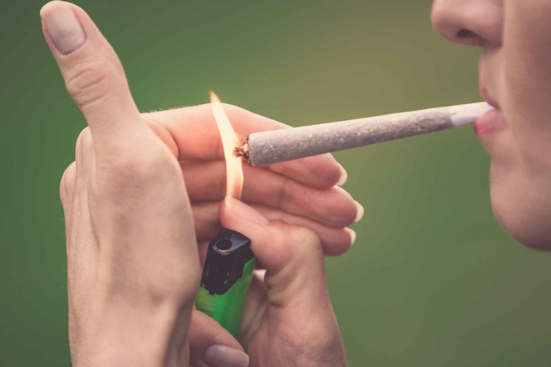 Person smoking marijuana, representing regular cannabis use.