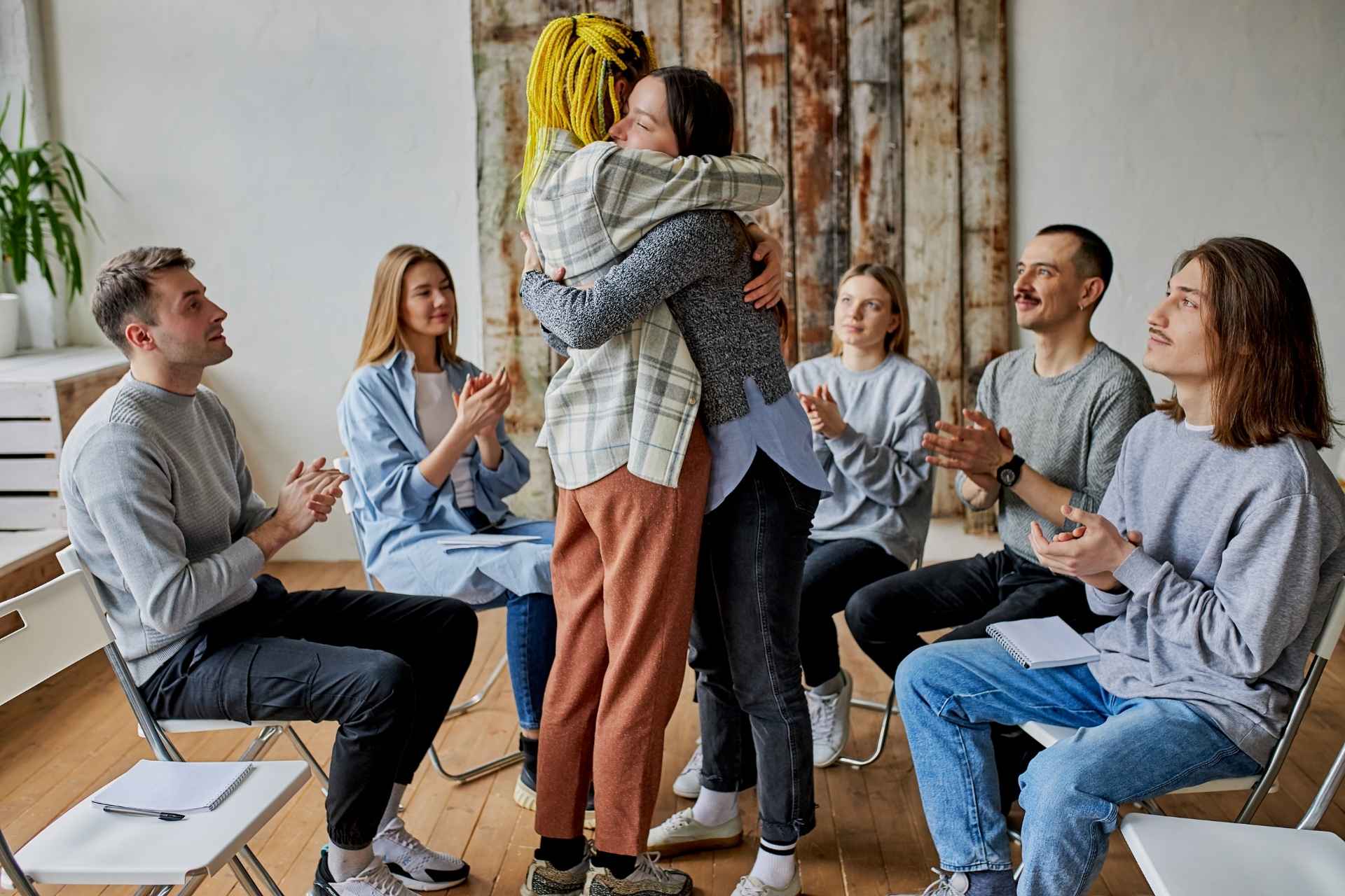 Family members supporting each other during addiction recovery therapy