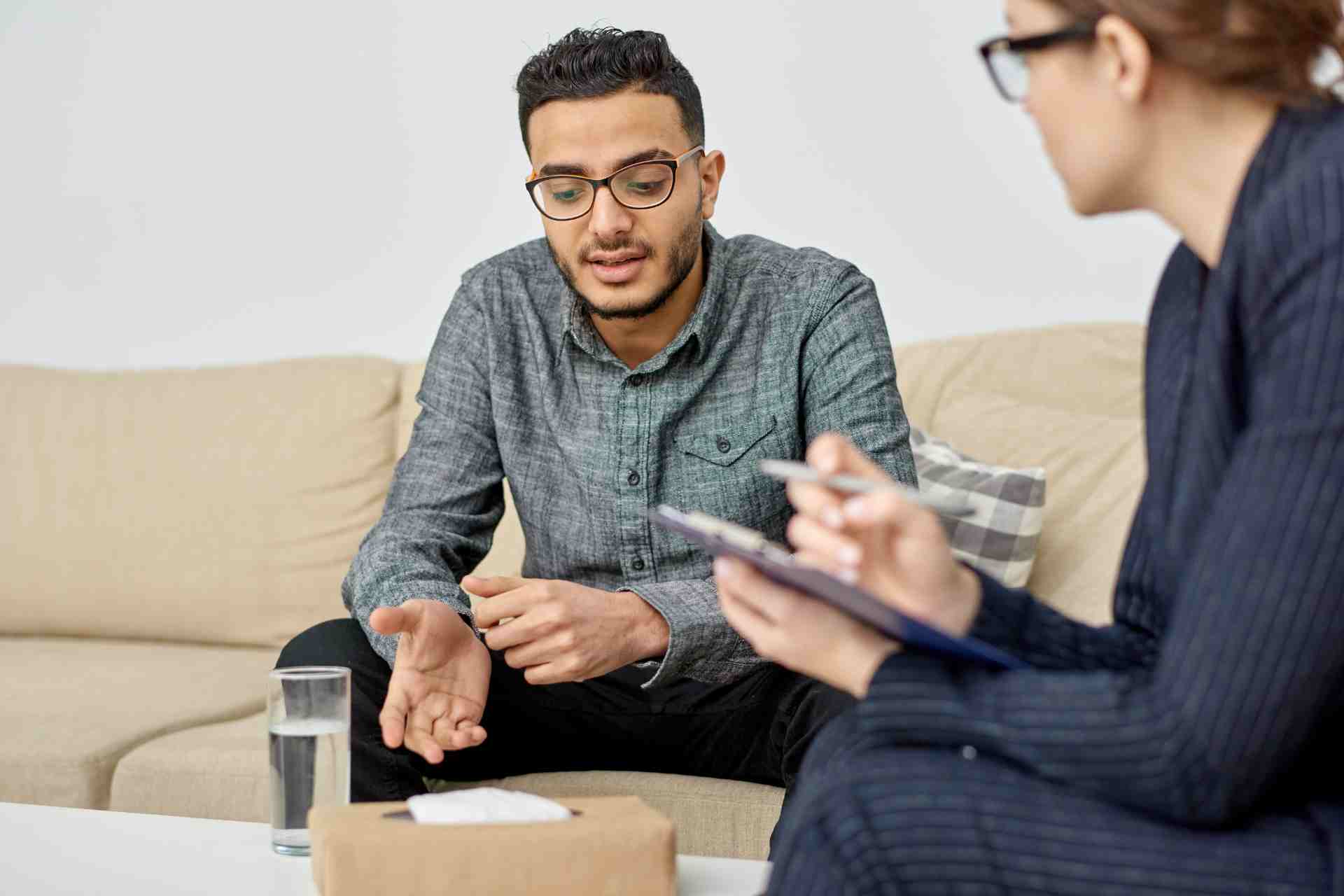 Man speaking with a therapist during an individual counseling session