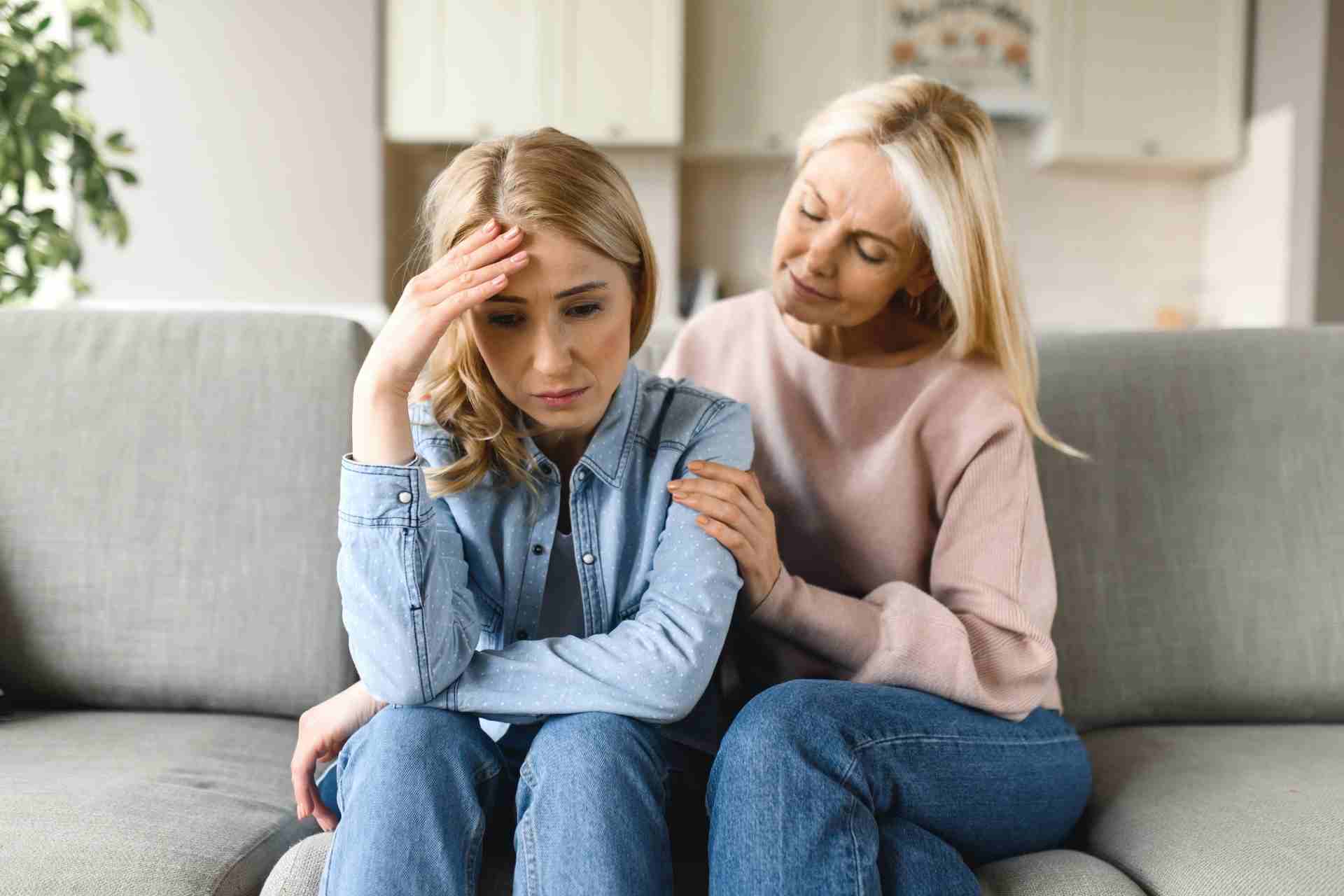 Family member comforting a loved one during a conversation about addiction and recovery support